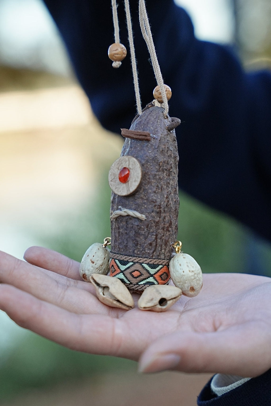 "The Tribal Cyclops" - Handcrafted Seed Pod Totem with Woven Belt & Single Eye