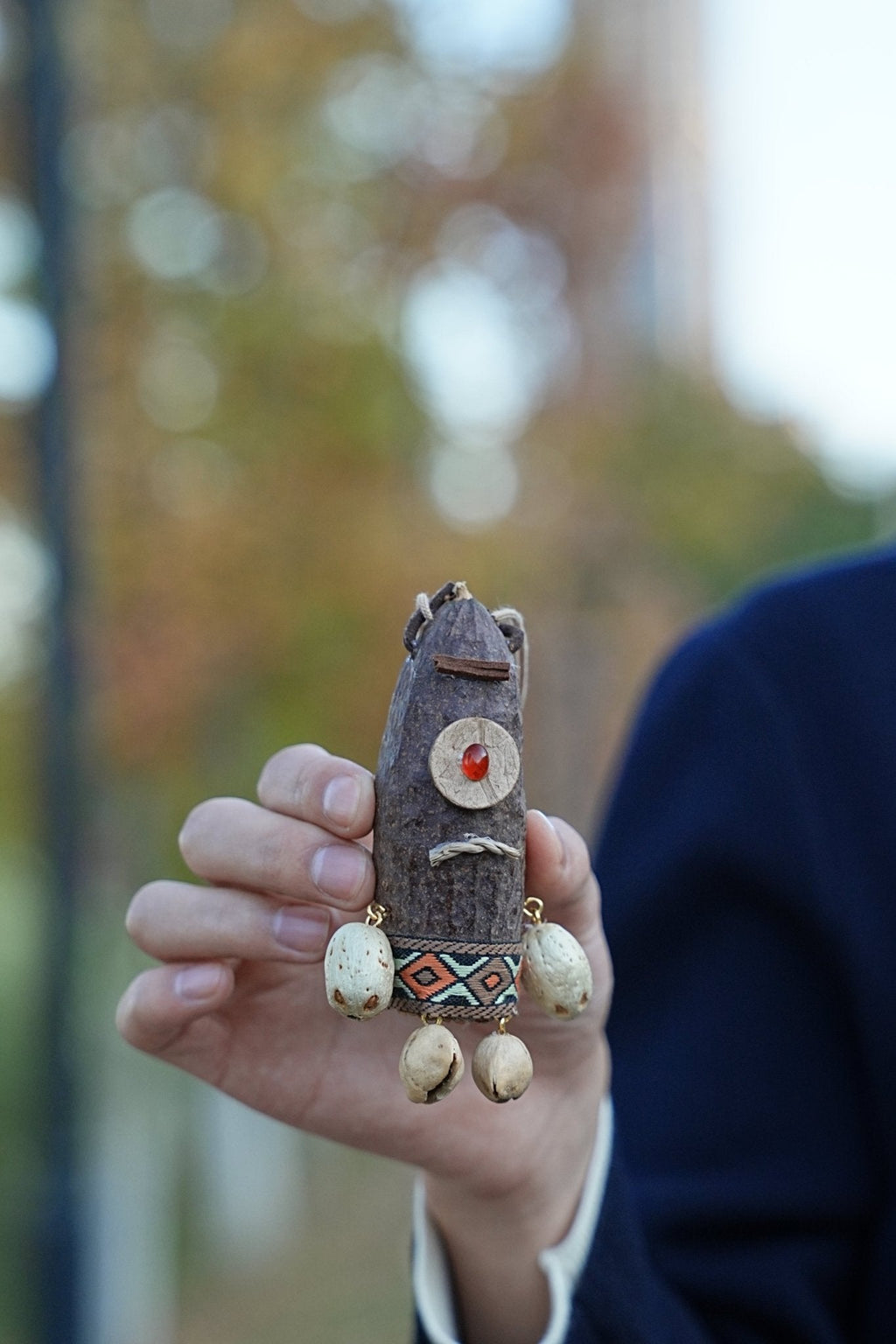 "The Tribal Cyclops" - Handcrafted Seed Pod Totem with Woven Belt & Single Eye